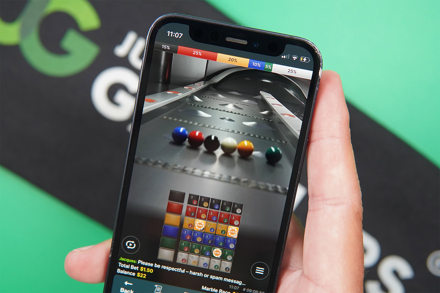 Photo of an iPhone with one of the best live casino games loaded Marble Rush
