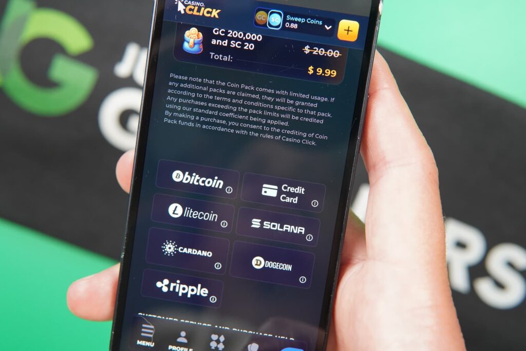 Patrik Lidin holding an iPhone showing available cryptocurrencies that are accepted by Casino Click.