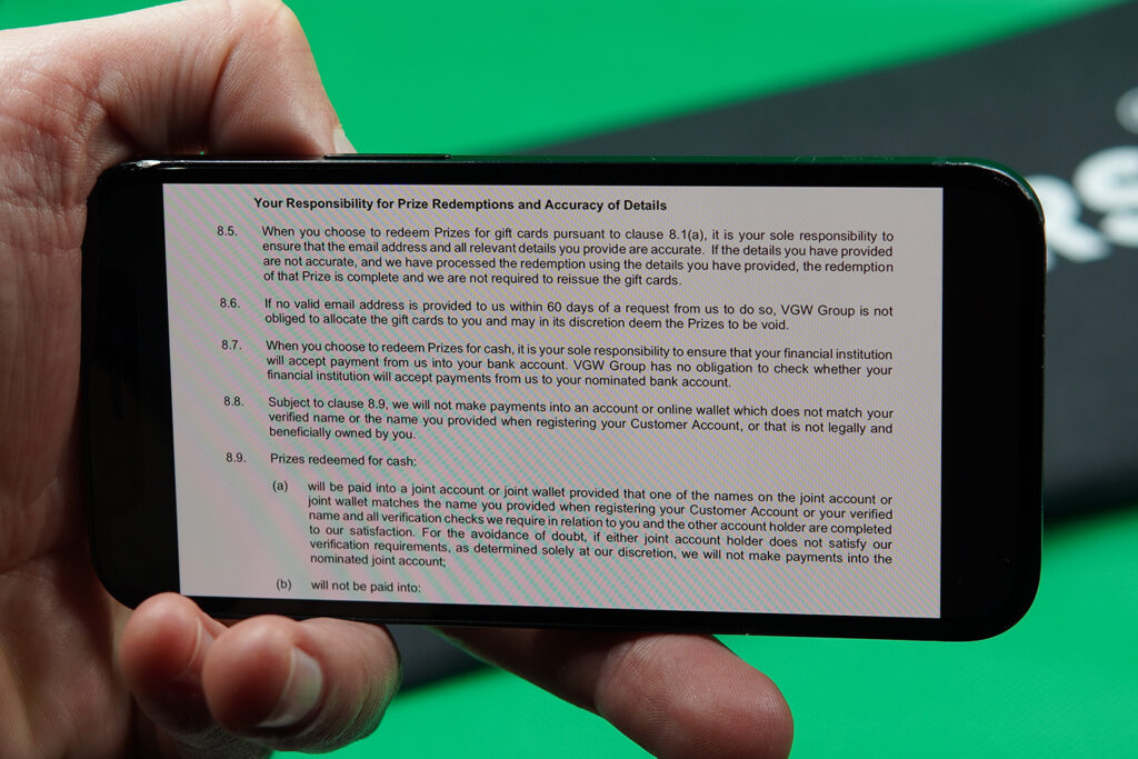 Photo of Patrik Lidin showing the Chumba Terms and Conditions for minimum SC cashout rules.