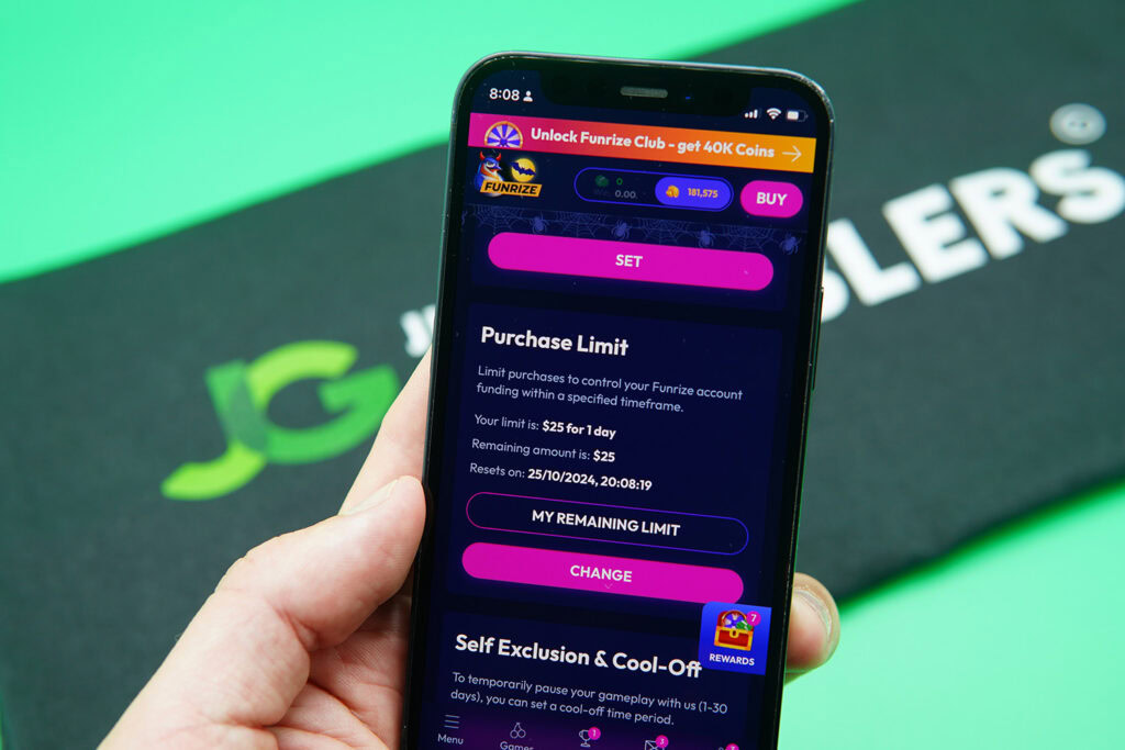 Patrik Lidin holding an iPhone with the Funrize responsible gambling page showing.