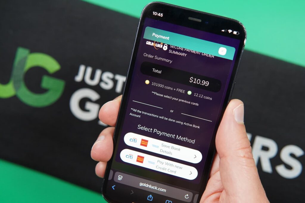 Patrik Lidin holding an iPhone with the GoldNLuck casino payments page loaded on the webpage.