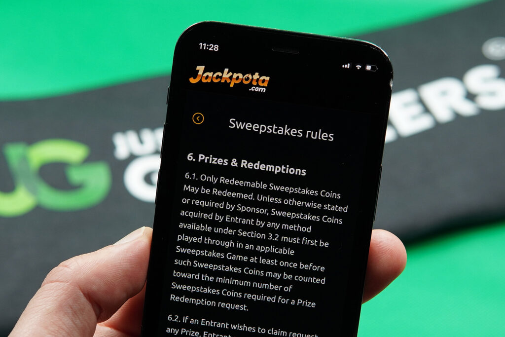 Photo of Patrik Lidin showing the Jackpota Terms and Conditions for minimum SC cashout rules.