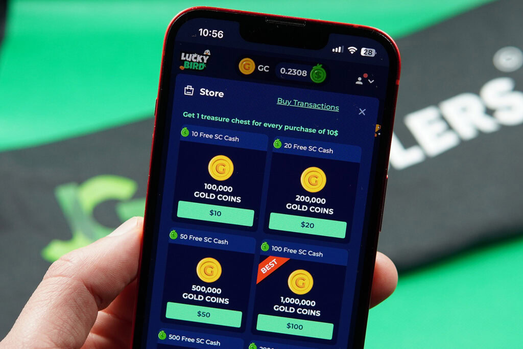 Patrik Lidin holding an iPhone showing offers for LuckyBird.io coin packages.