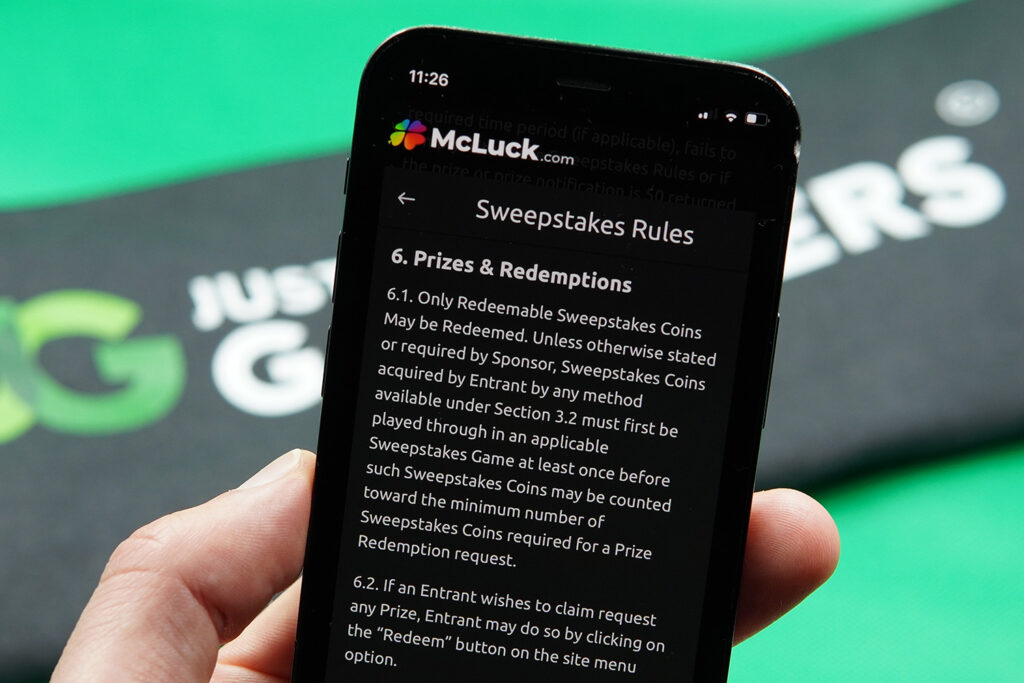 Photo of Patrik Lidin showing the McLuck Terms and Conditions for minimum SC cashout rules.