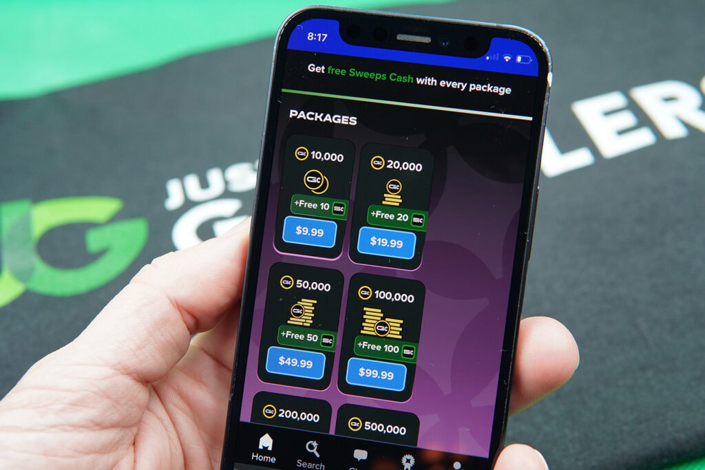 Patrik Lidin holding an iPhone showing offers for MyPrize US coin packages.