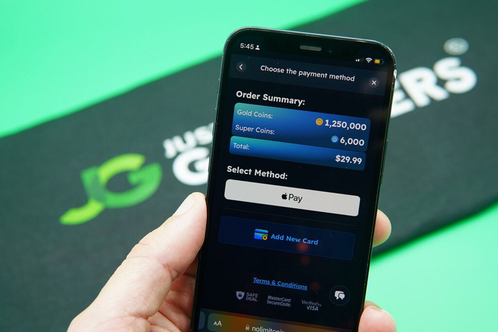 Patrik Lidin holding an iPhone when purchasing coins on NoLimitCoins casino.