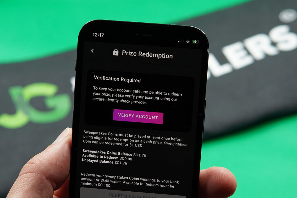 Patrik Lidin holding an iPhone showing the Pulsz Bingo KYC process.
