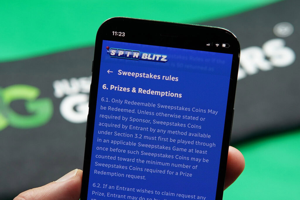 Photo of Patrik Lidin showing the SpinBlitz Terms and Conditions for minimum SC cashout rules.