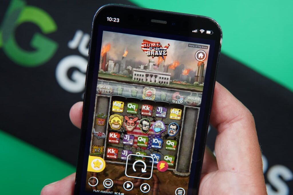 Patrik Lidin holding an iPhone with the Stackr casino in-game page loaded on the webpage.
