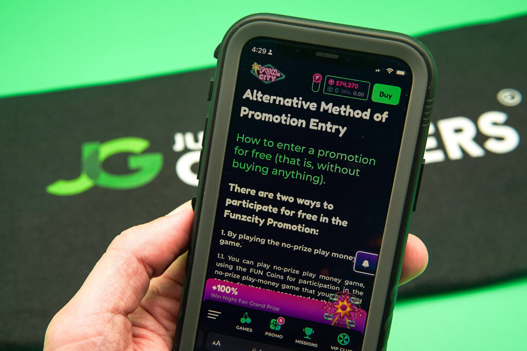 Photo of Patrik Lidin holding an iPhone showing a sweepstakes casino AMOE page.