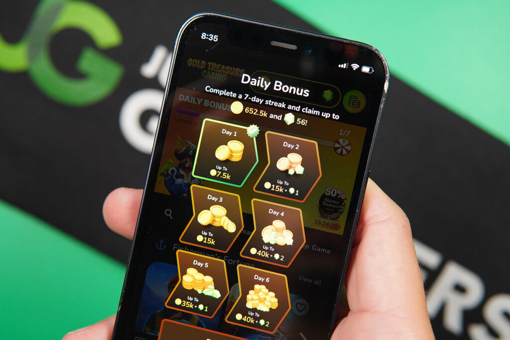 Photo of Patrik Lidin holding an iPhone with daily no deposit bonuses showing.